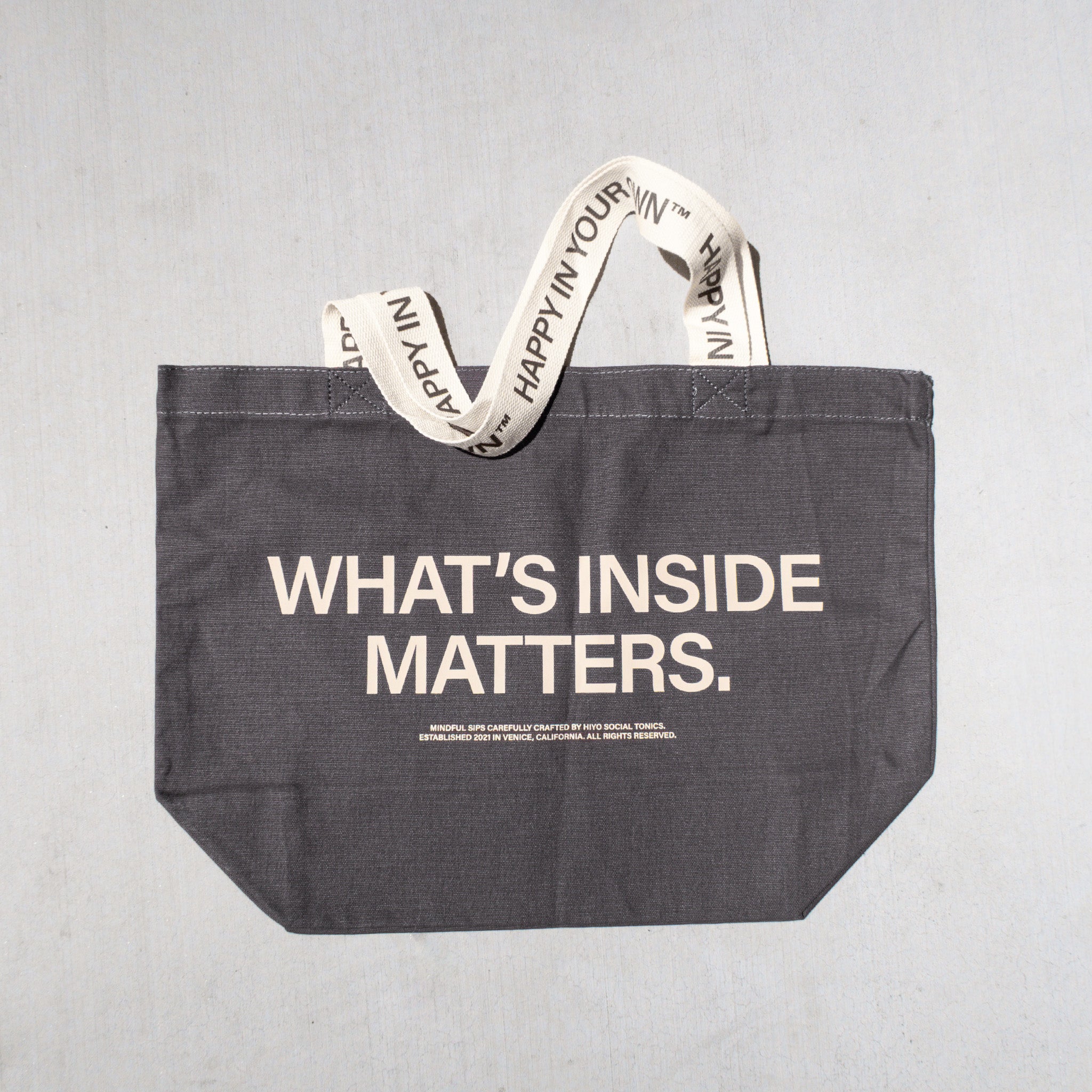 hiyo-rewards-merch-tote-charcoal-whatsinside-front-low.jpg