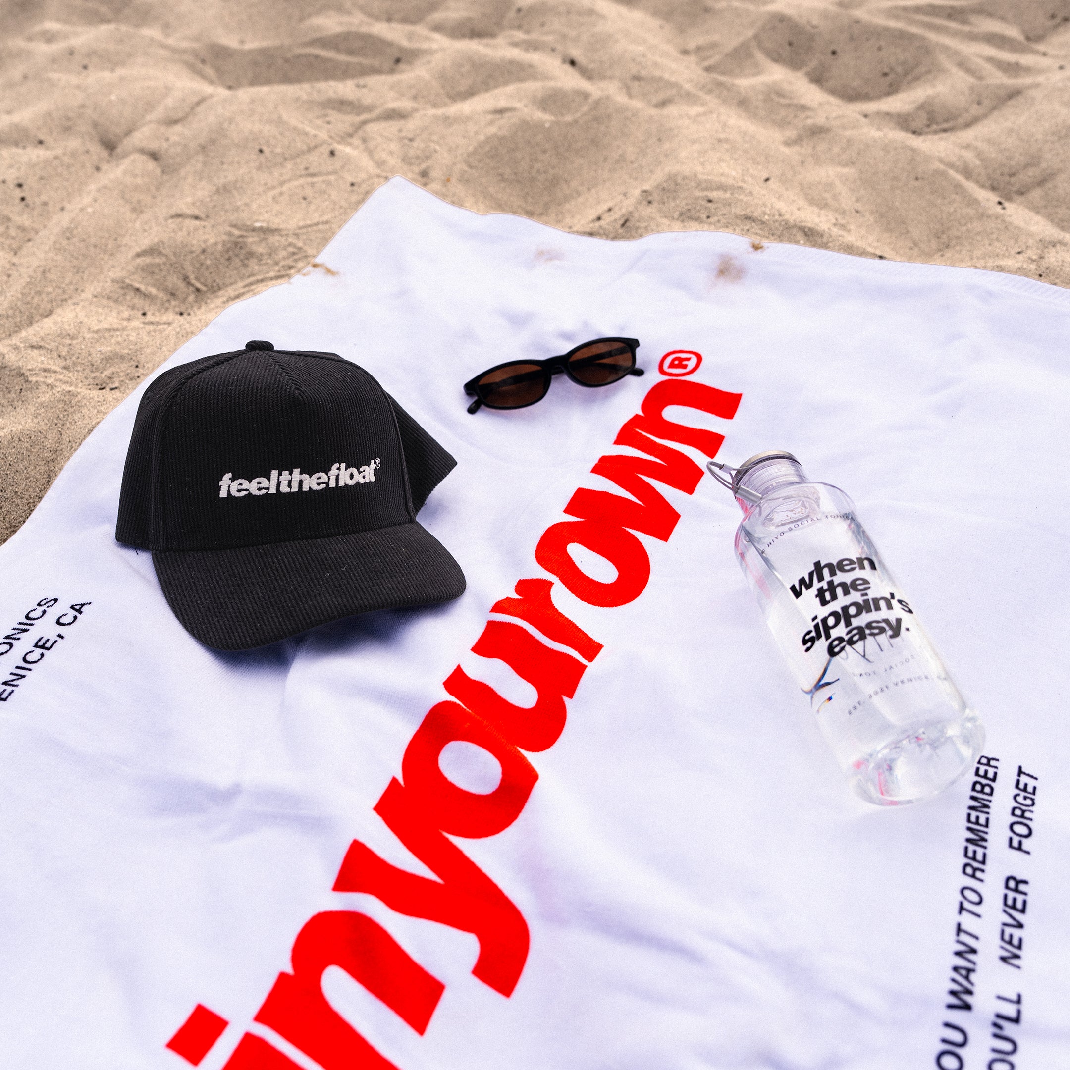 hiyo-summer-merch-beach-towel-3-lifestyle.jpg